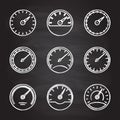 Speedometer and meter icon set isolated on blackboard texture with chalk rubbed background. Dashboard outline signs. Vector